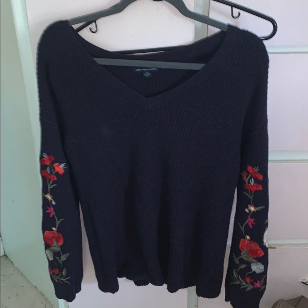 navy sweater with floral sleeves